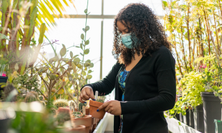 ​​Biology major Caityana Hanson ’22 is a student worker in Augsburg's Plant Growth Facilities.